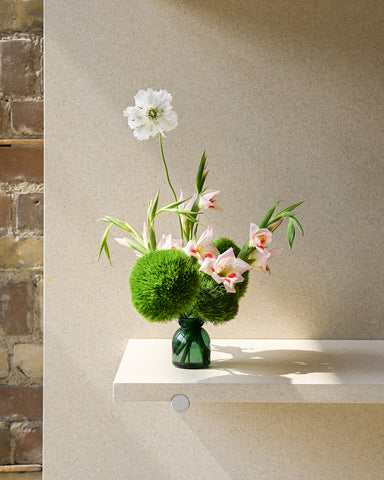 gather vase e green glass fresh flowers